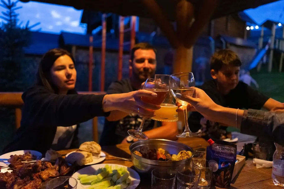 A toast at dinner, Greek catering, illustrative photo